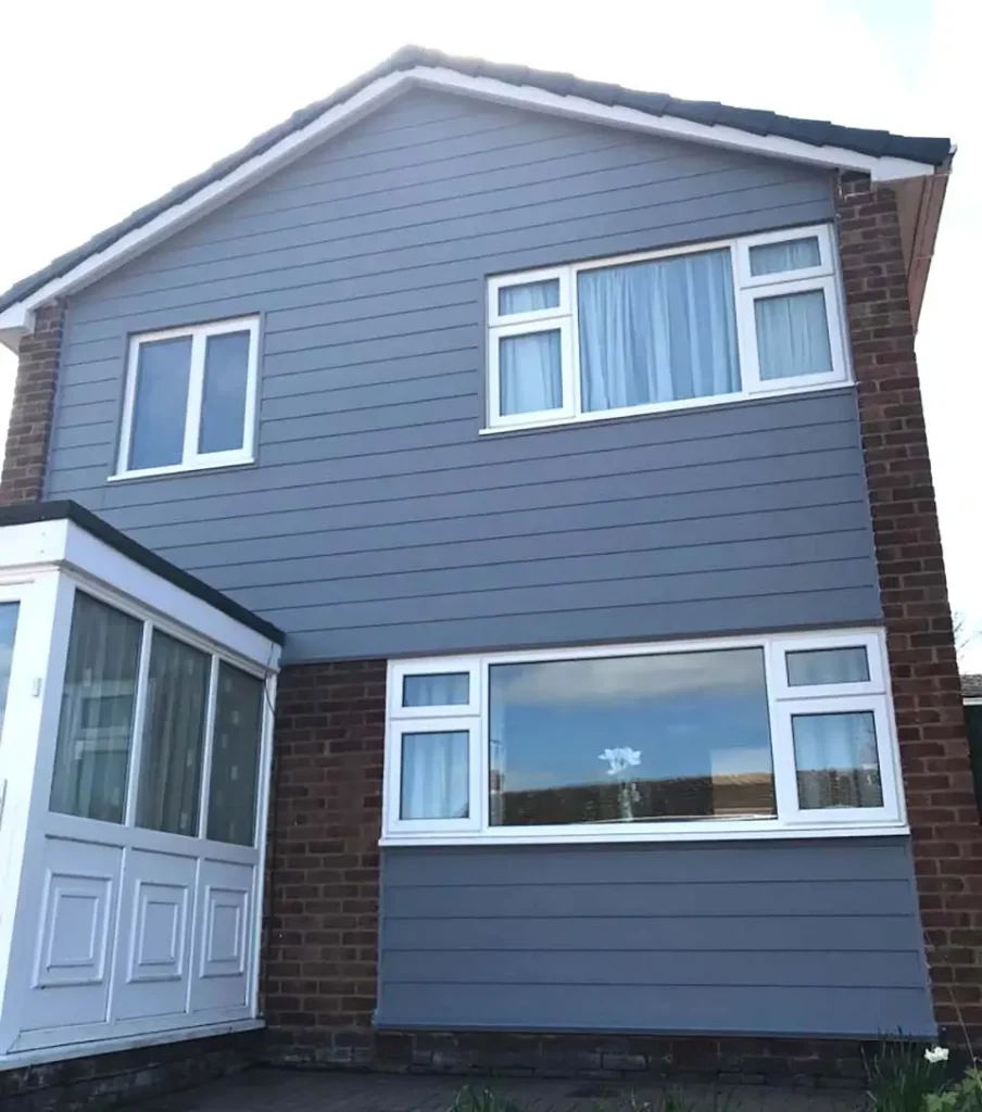 Blue horizontal cladding installed on a residential house, highlighting Roofing Whangarei’s trusted Cladding Services Whangarei.