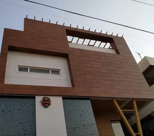 Contemporary wooden cladding on a residential façade delivered by Roofing Whangarei’s Cladding Services Whangarei.