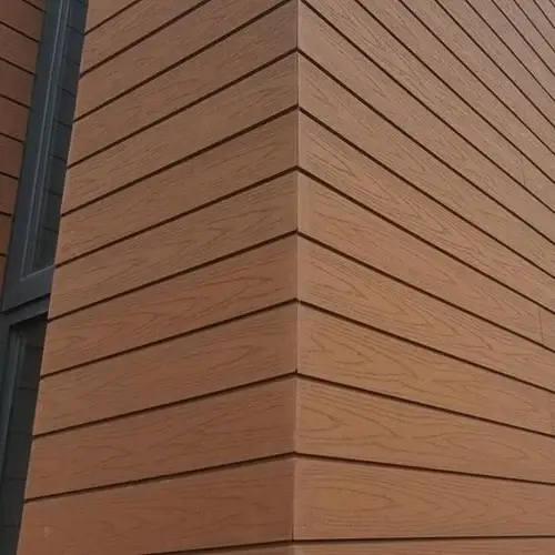 Durable wooden-texture horizontal cladding installed by Roofing Whangarei, showcasing trusted Cladding Services Whangarei.
