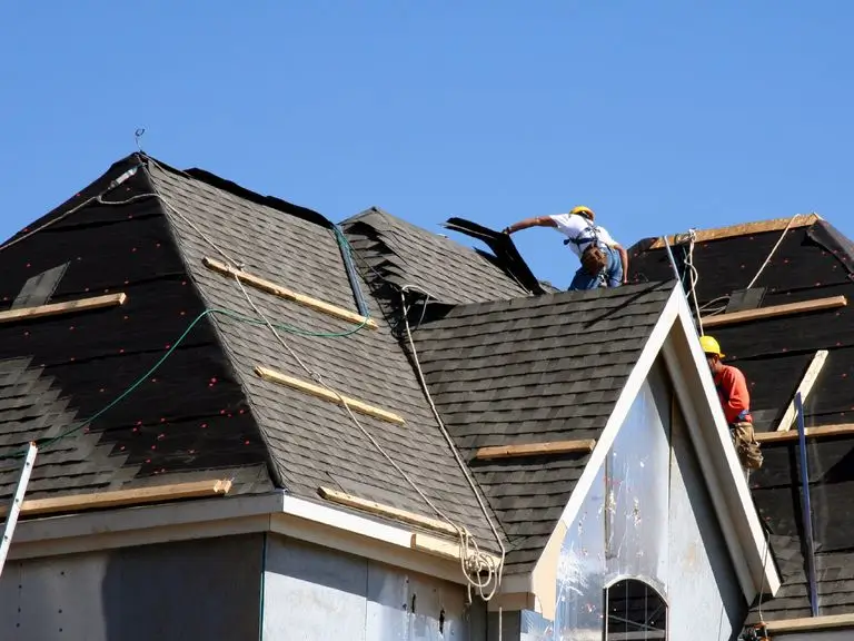Skilled crew from Roofing Whangarei re-roofing a complex multi-gable roofline.