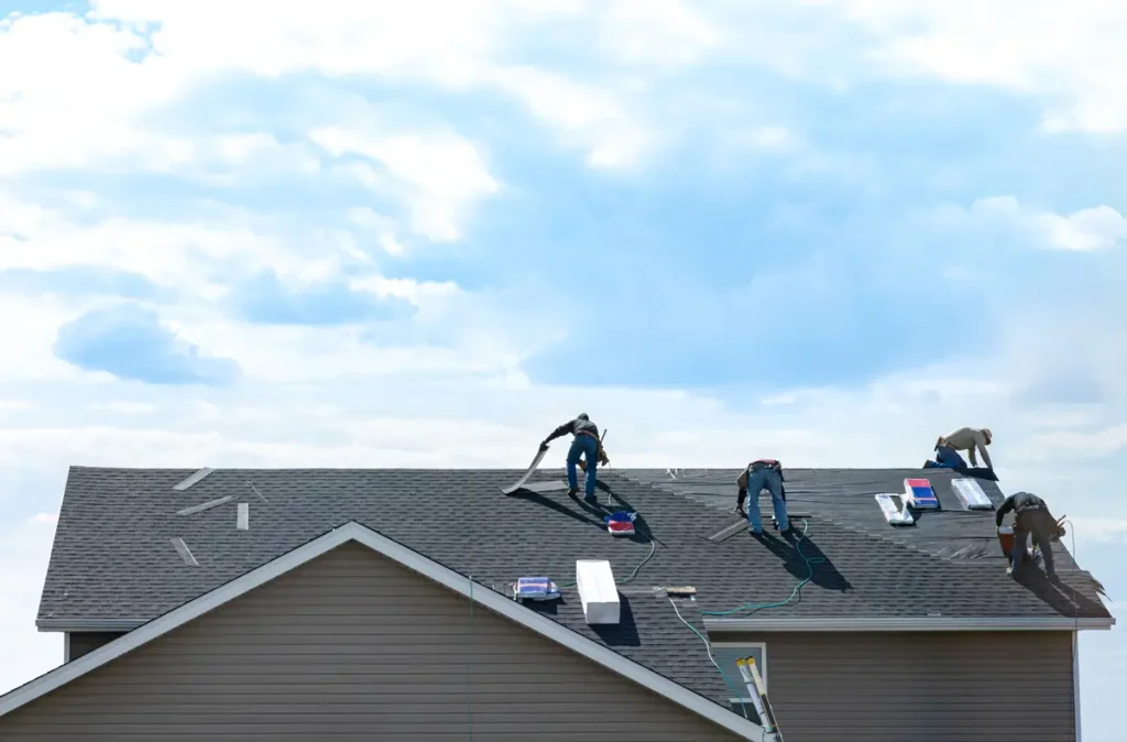 Slate tiles being fitted by a skilled tradesman during Roofing Whangarei roof repairs.