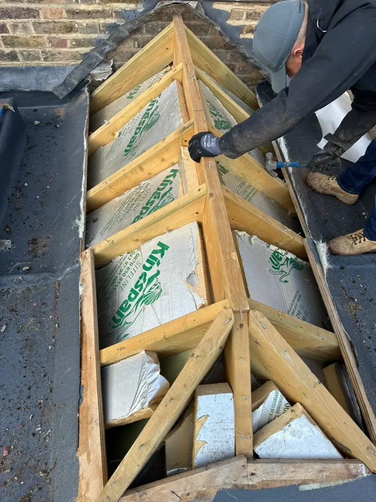 Structural timber repair in progress by Roofing Whangarei as part of roof repairs beneath old insulation.